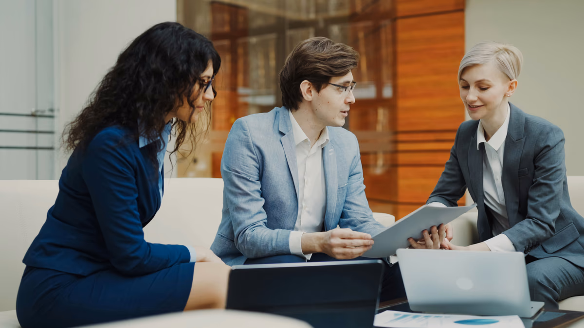 A split image showing an AI chat interface on one side and a person meeting with a financial advisor on the other