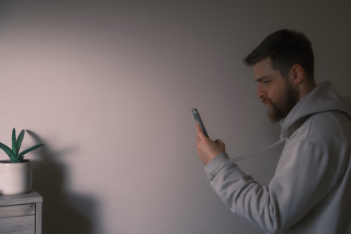 A person typing a question into an AI chat interface on a laptop