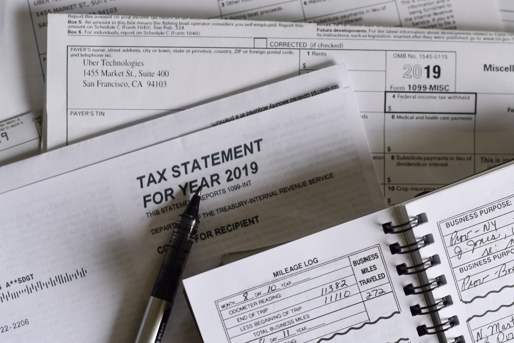 Tax documents and calculator on a desk